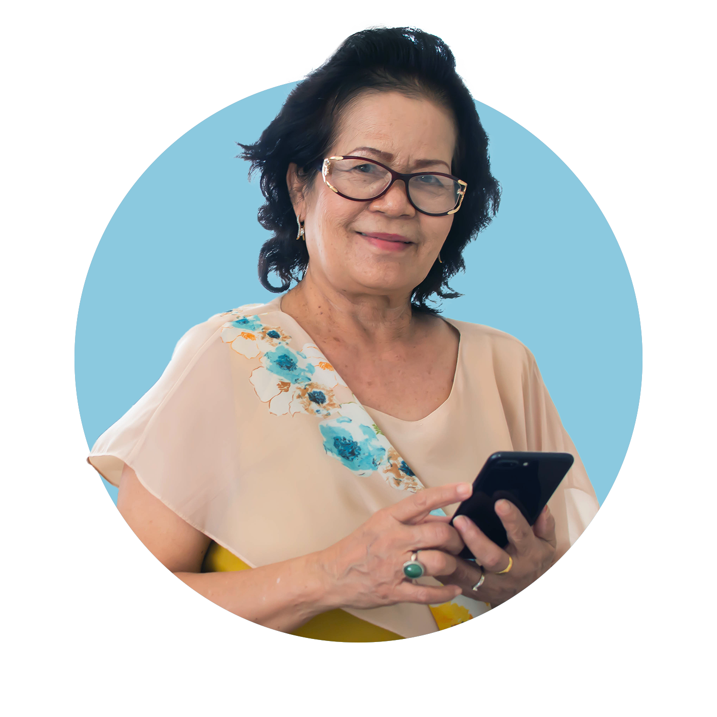 Portrait of woman holding her phone and smiling at the camera