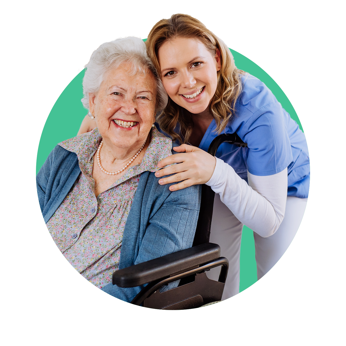 Elder woman in a wheelchair with nurse behind her both smiling towards the camera
