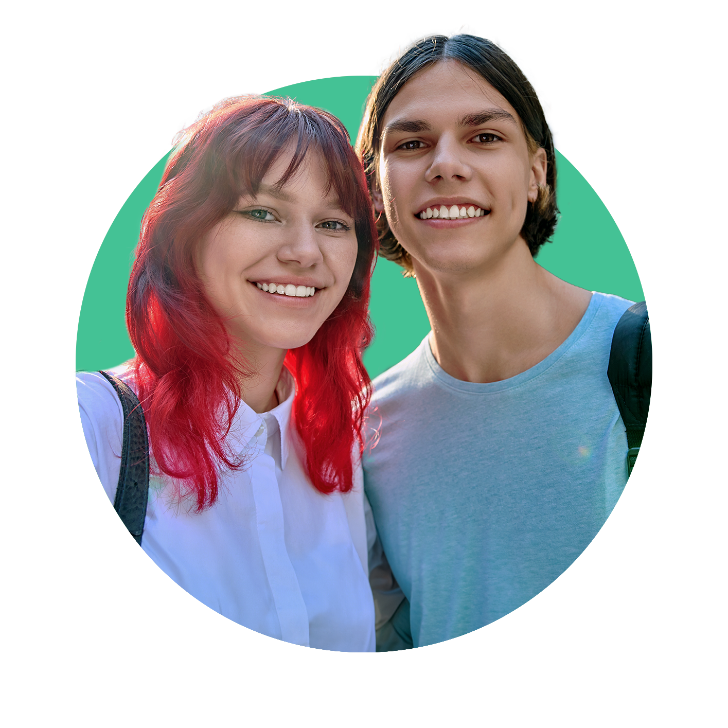 Two teenagers smiling at the camera