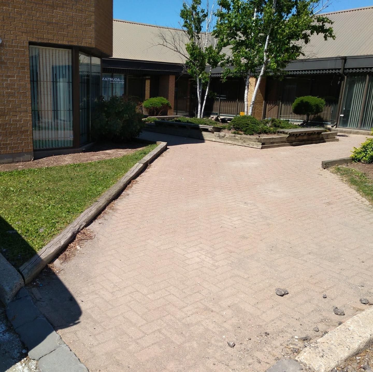A brick walkway leading to a brick building