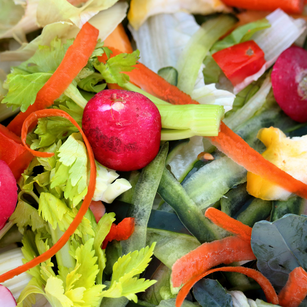 A salad with radishes carrots celery and other vegetables