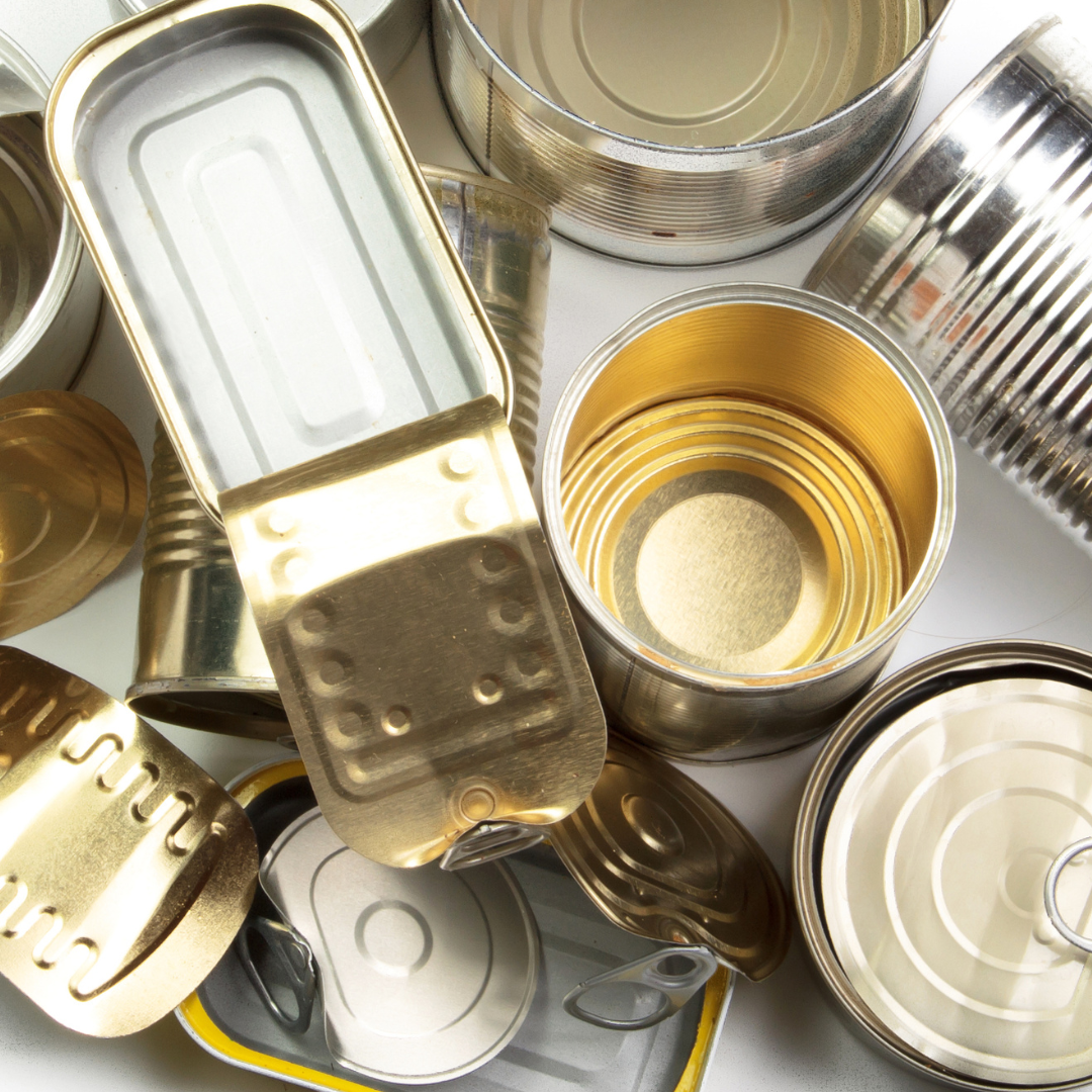 A pile of cans with one that says ' snl ' on it