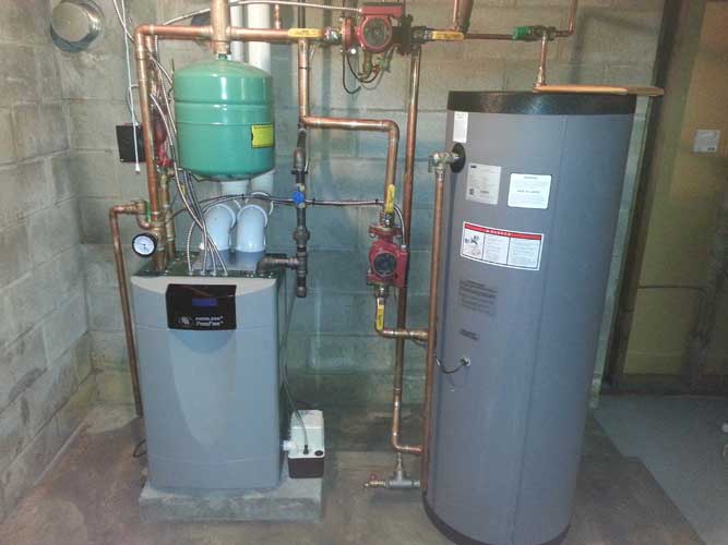 A boiler and a water heater in a basement