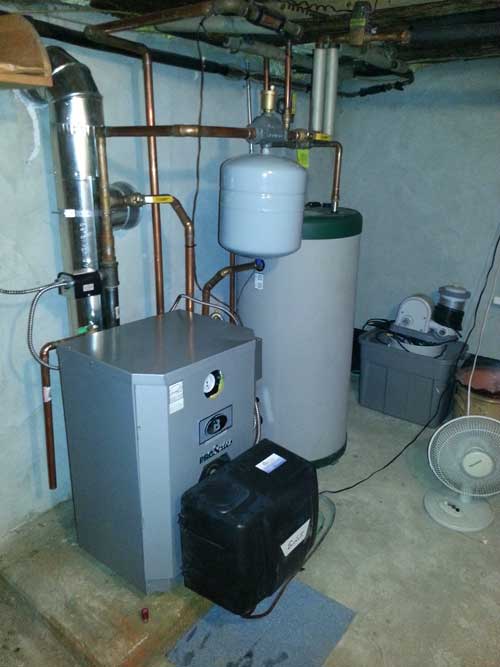 A room with a water heater and a fan