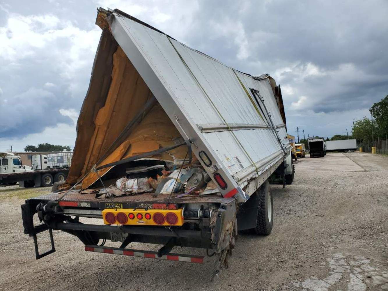 The back of a dump truck with a tarp on it