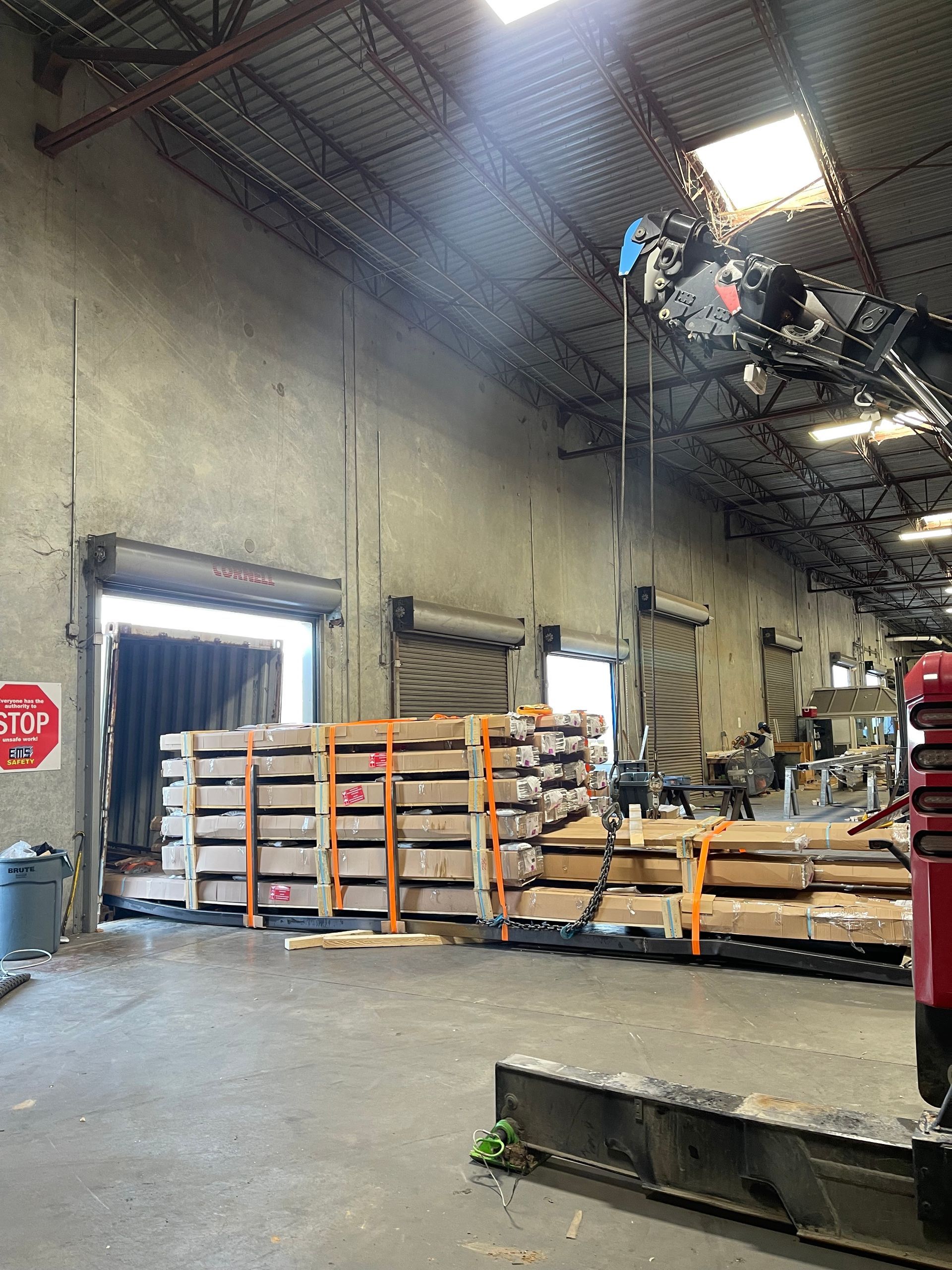 A large warehouse with a stop sign on the wall