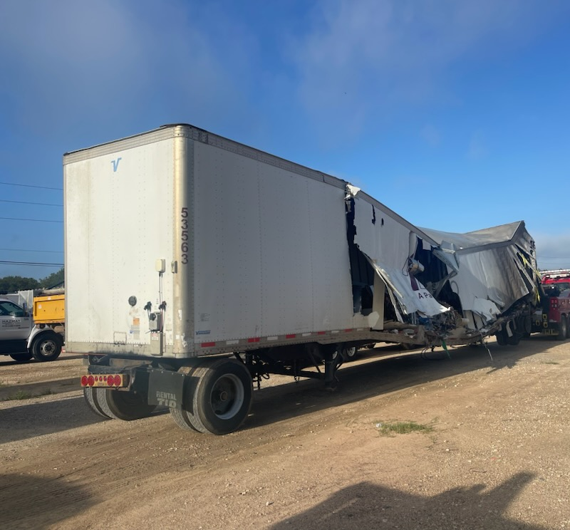 A white semi truck with the letter y on the side