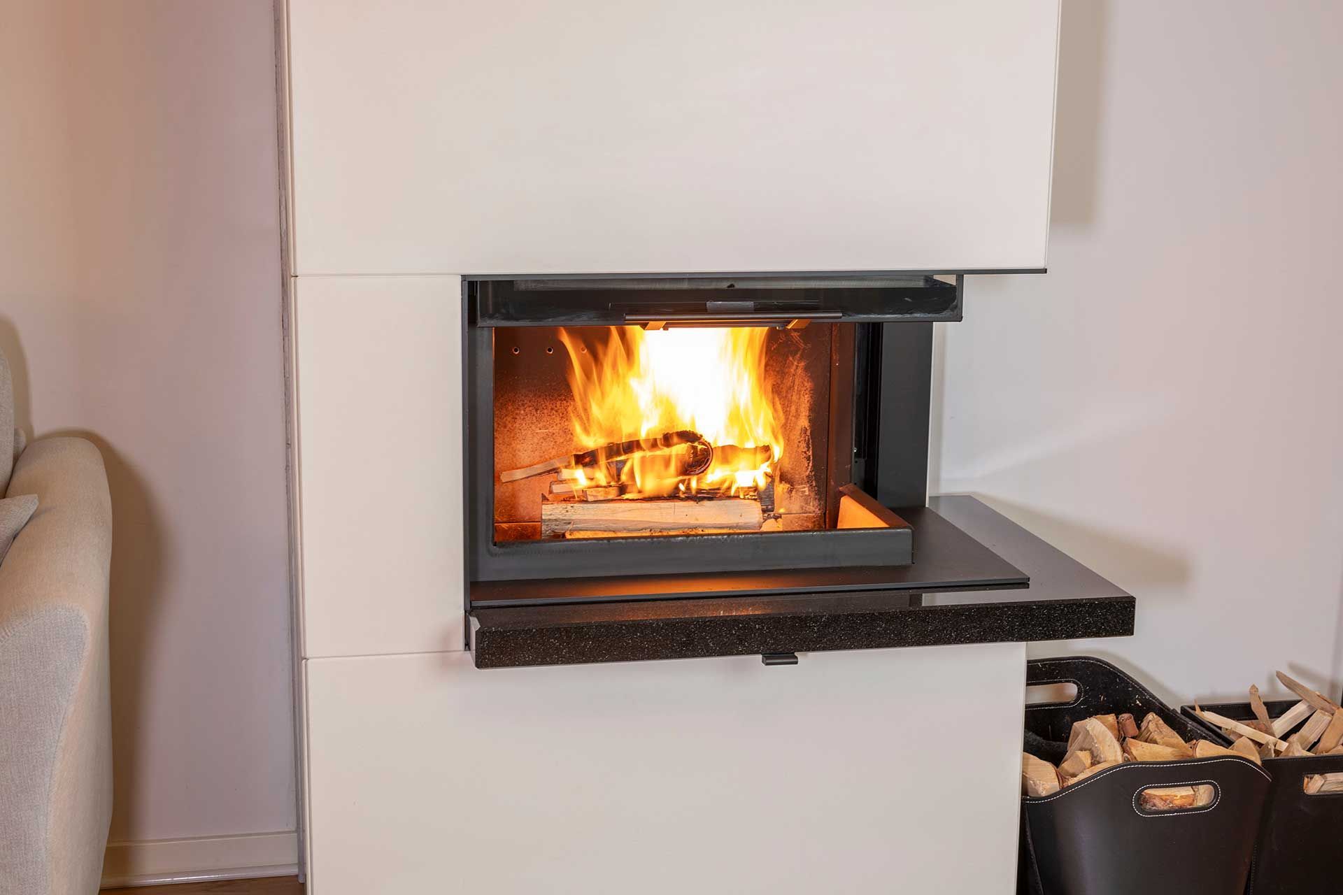Beautiful view of interior of modern living room. View of burning wood in fireplace. Beautiful backgrounds.  
