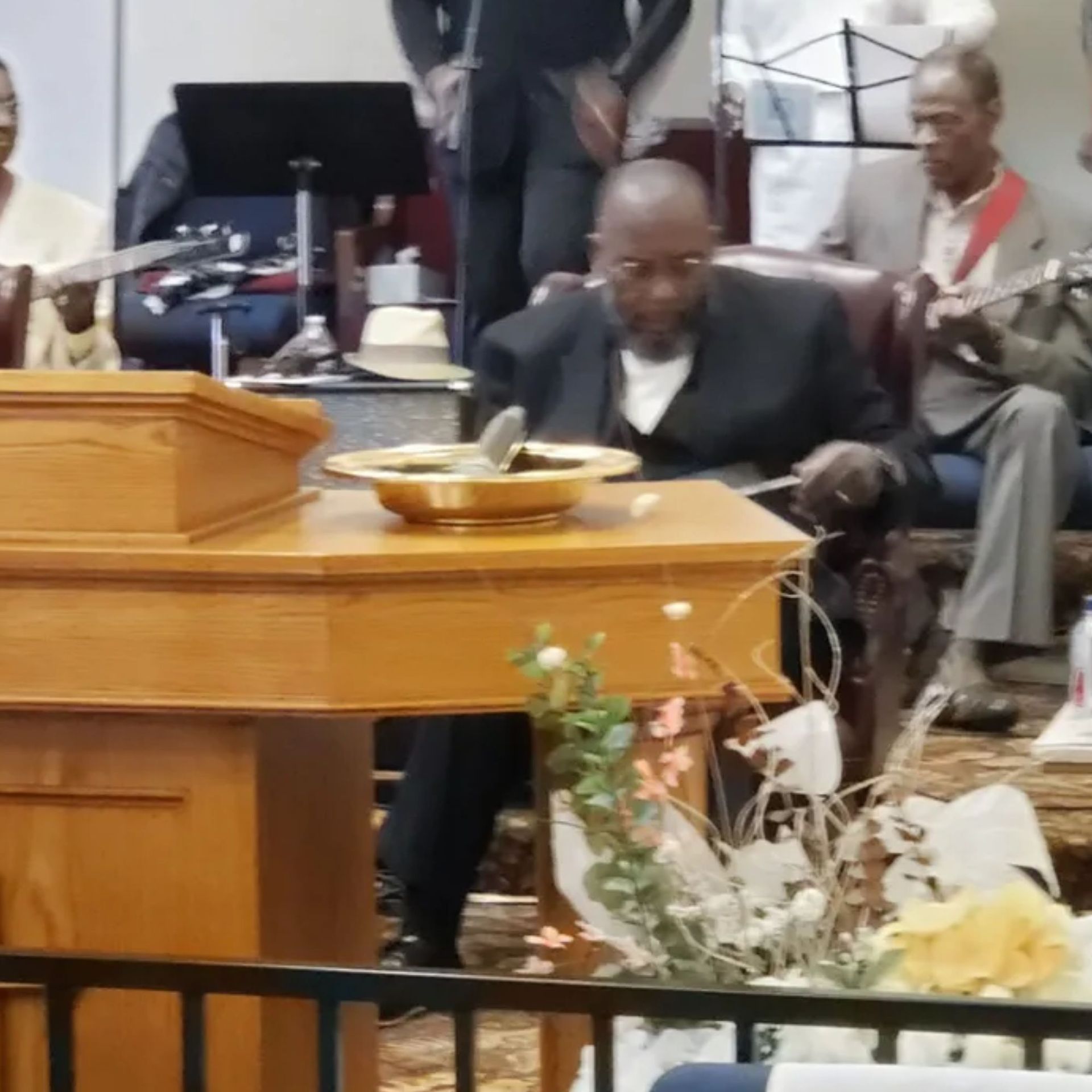 A man sits at a table with a bowl of food on it