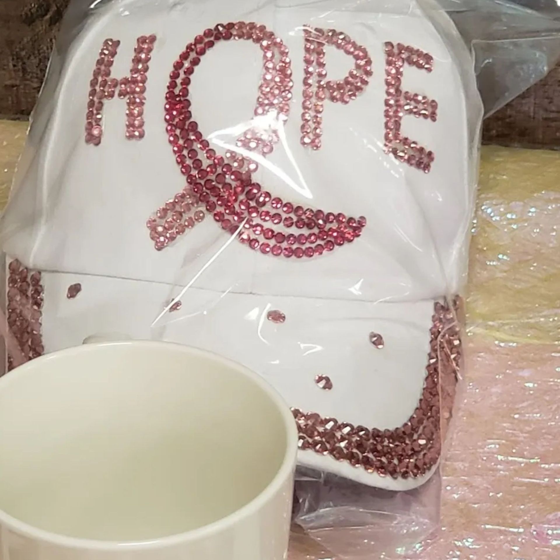 A white hat with the word hope on it