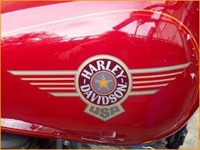 A close up of the Harley-Davidson USA logo on the side of a red motorbike