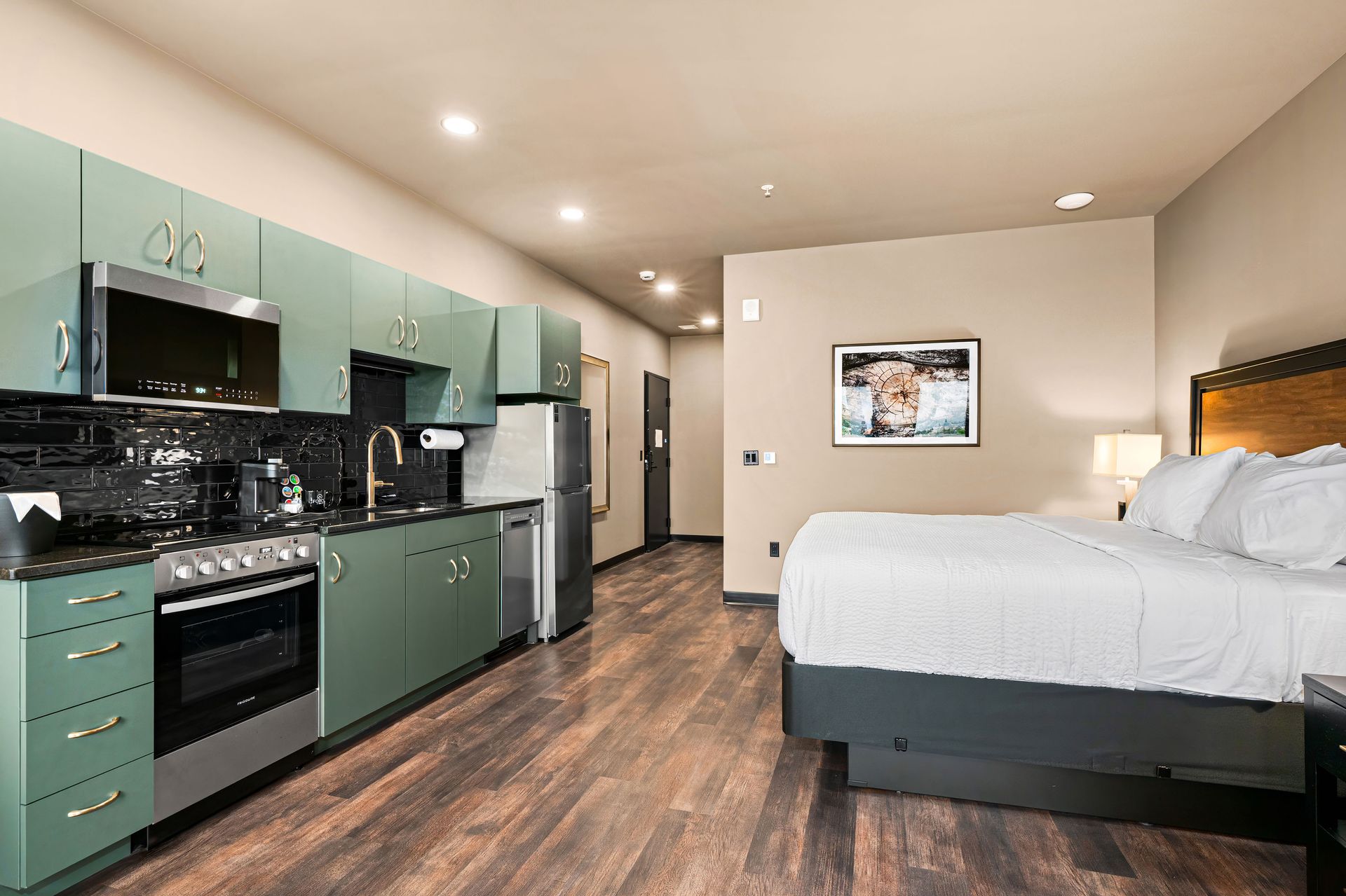 An aerial view of a bedroom , living room , and bathroom.