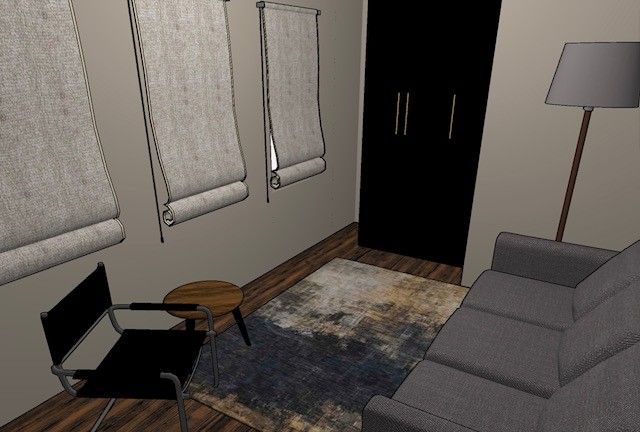 A living room with a couch , chair , table and lamp.