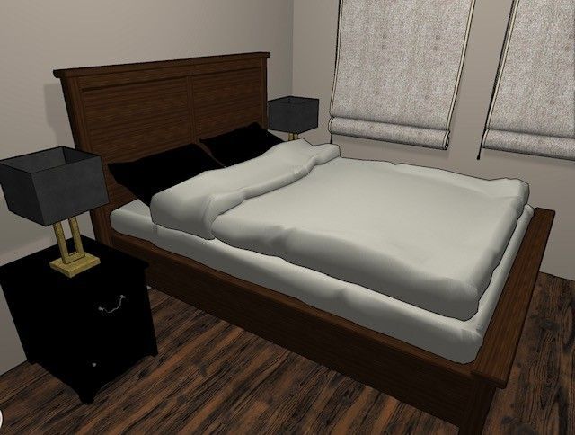 A bedroom with a bed nightstand and two lamps