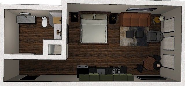 An aerial view of a bedroom , living room , and bathroom.
