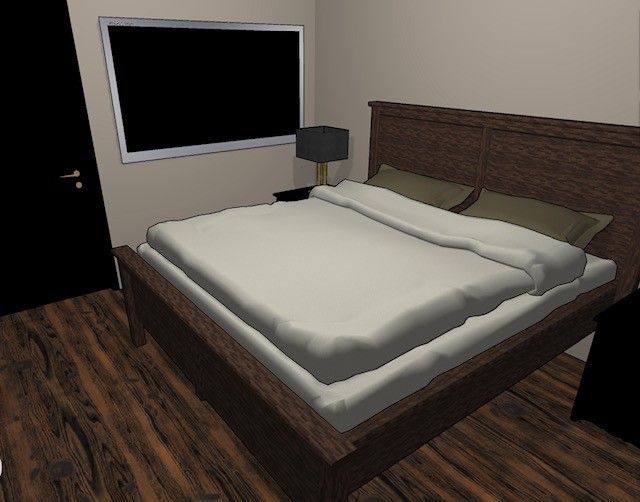 A bedroom with a large bed and a television