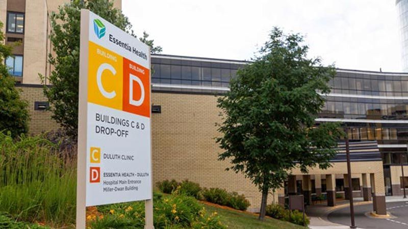 A large building with a sign in front of it that says cd