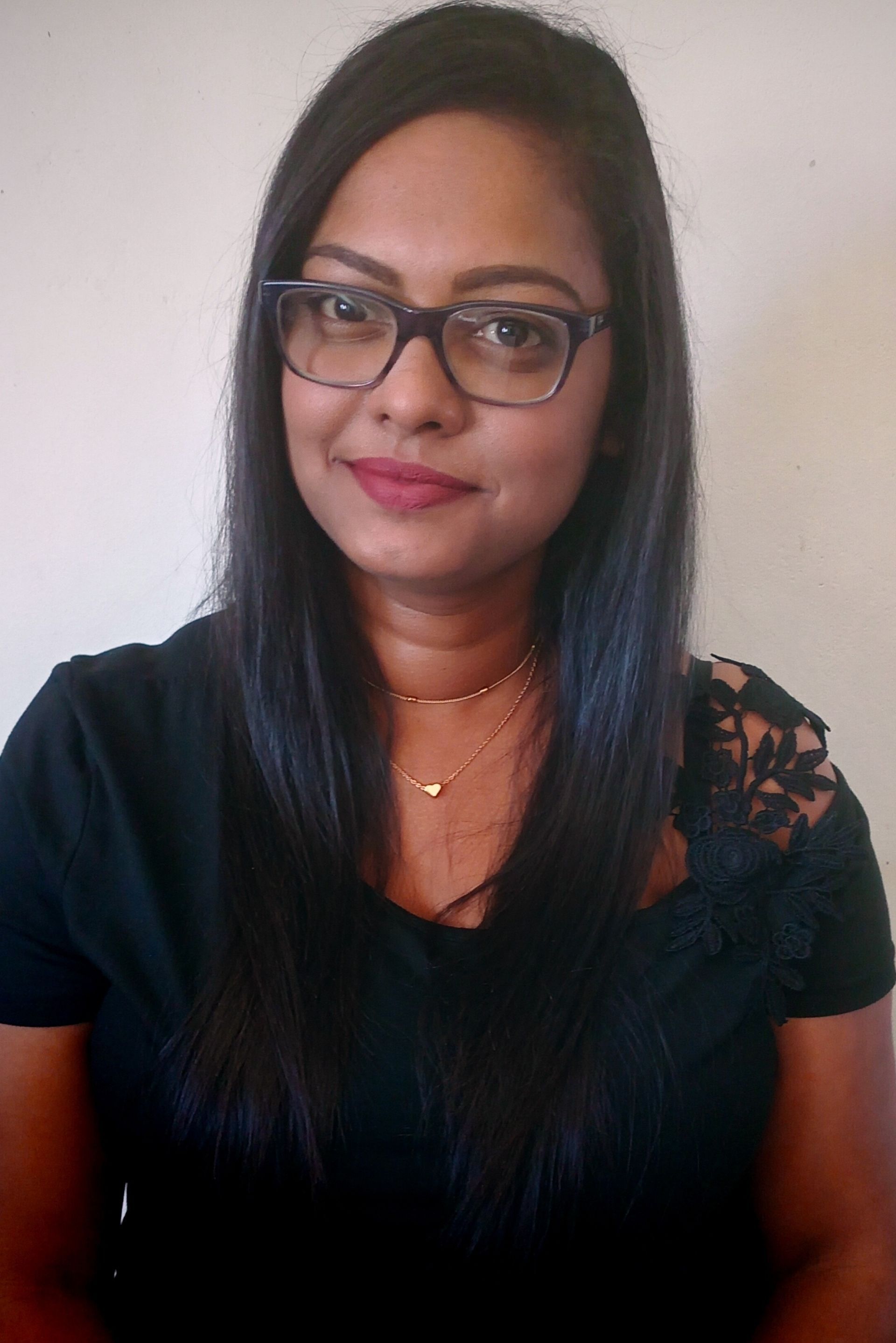 Pavlova Maharaj - woman wearing black top. 