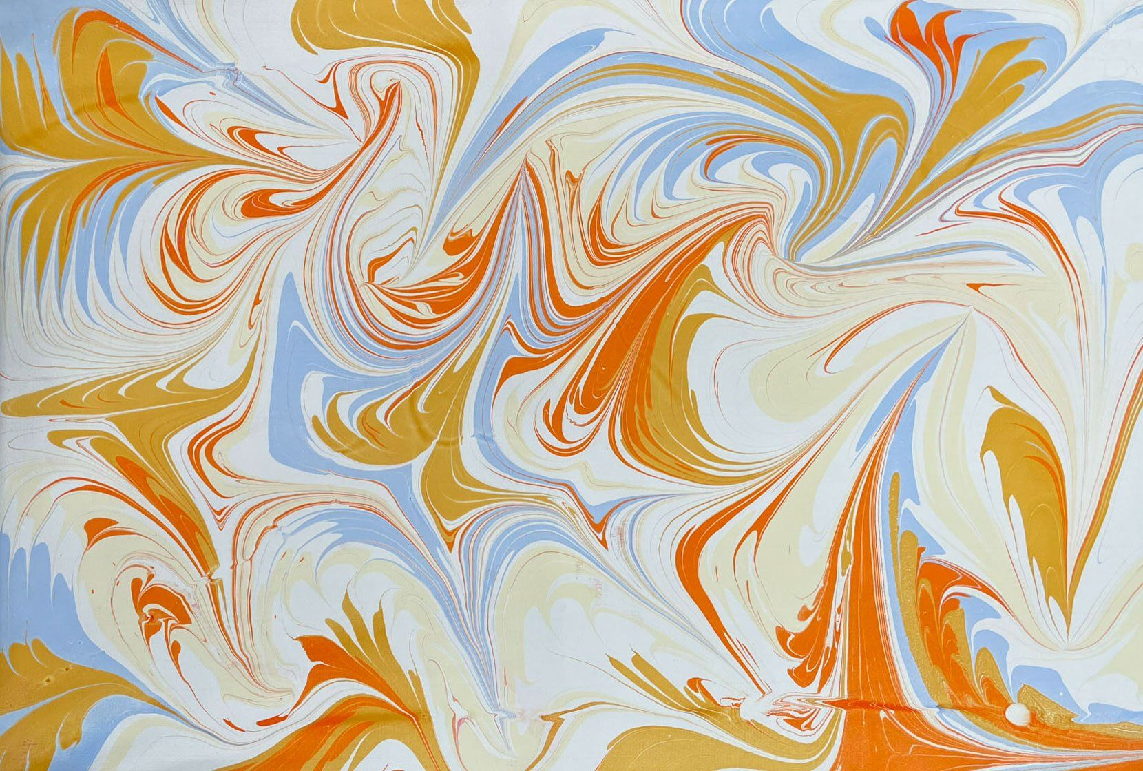 Oranges and blues create this satisfying pointed design in marbled paper.