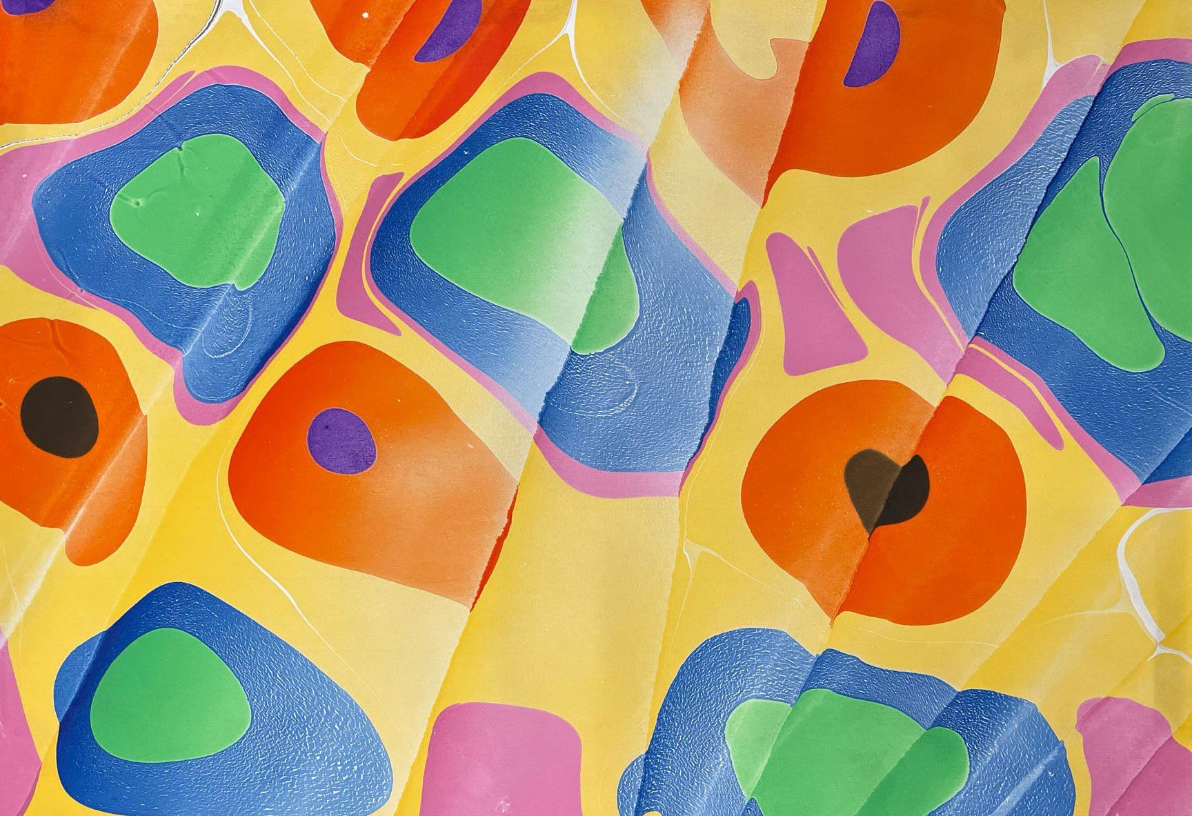 Playful Spanish technique over bright rings in marbled paper.