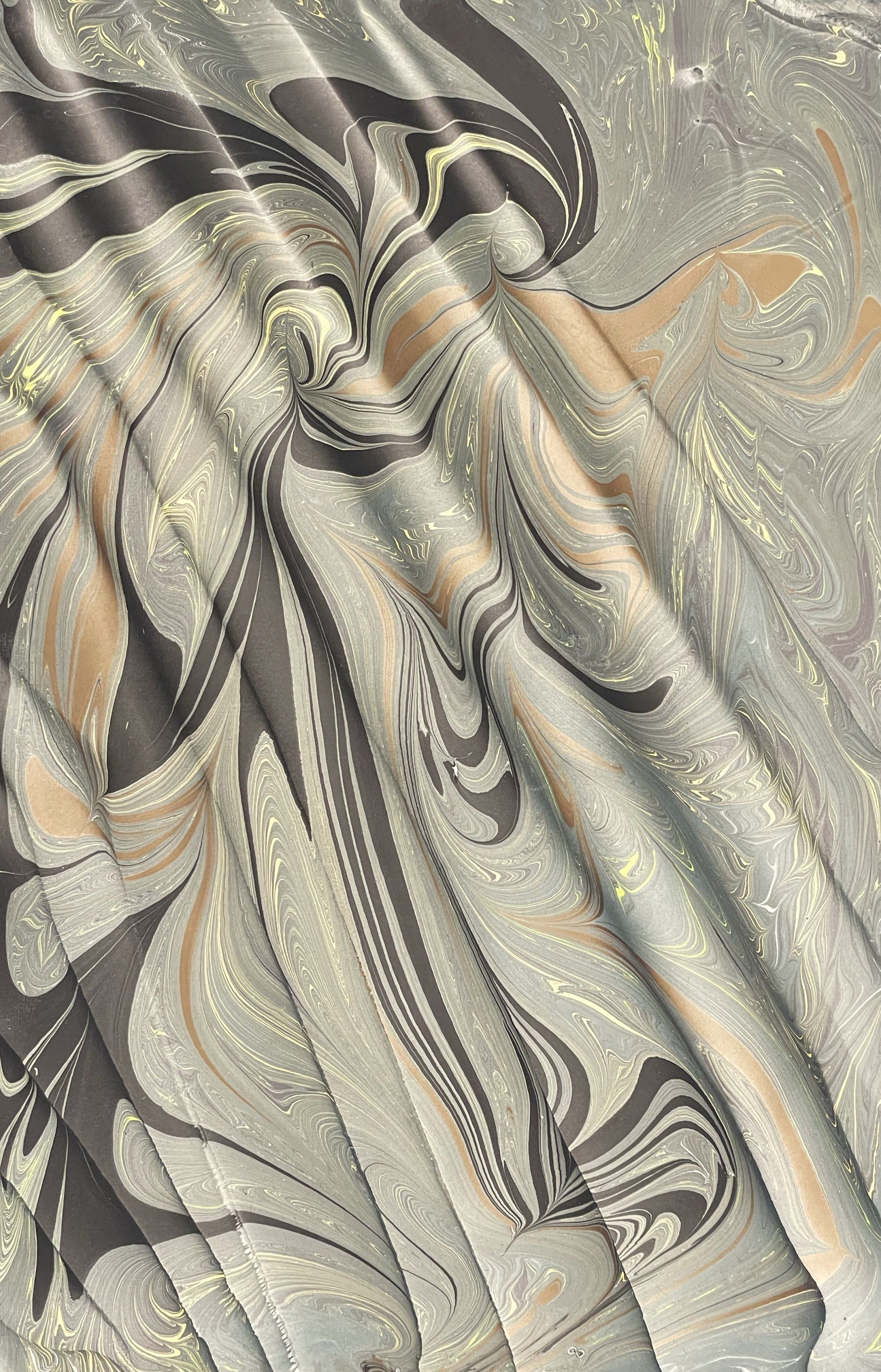Silver and Bronze rippling colors in a marbled artwork.