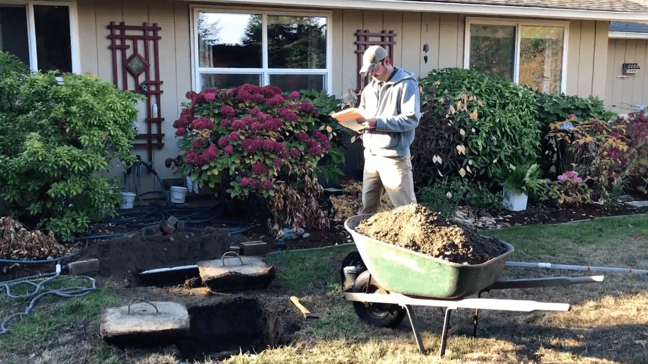 Septic service professionals are inspecting a septic tank to see if it is in proper working condition.