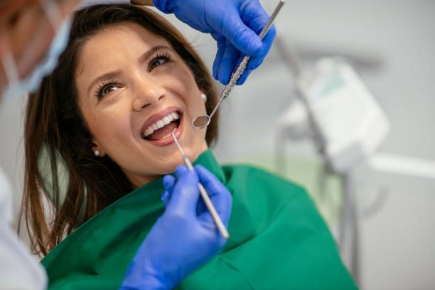 Young woman receiving professional dentistry care during a routine dental visit