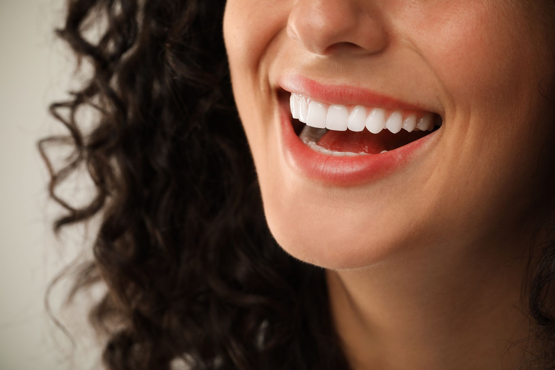 Close-up of a bright, white smile showing the results of cosmetic dental treatment. Close-up of a bright, white smile showing the results of cosmetic dental treatment.