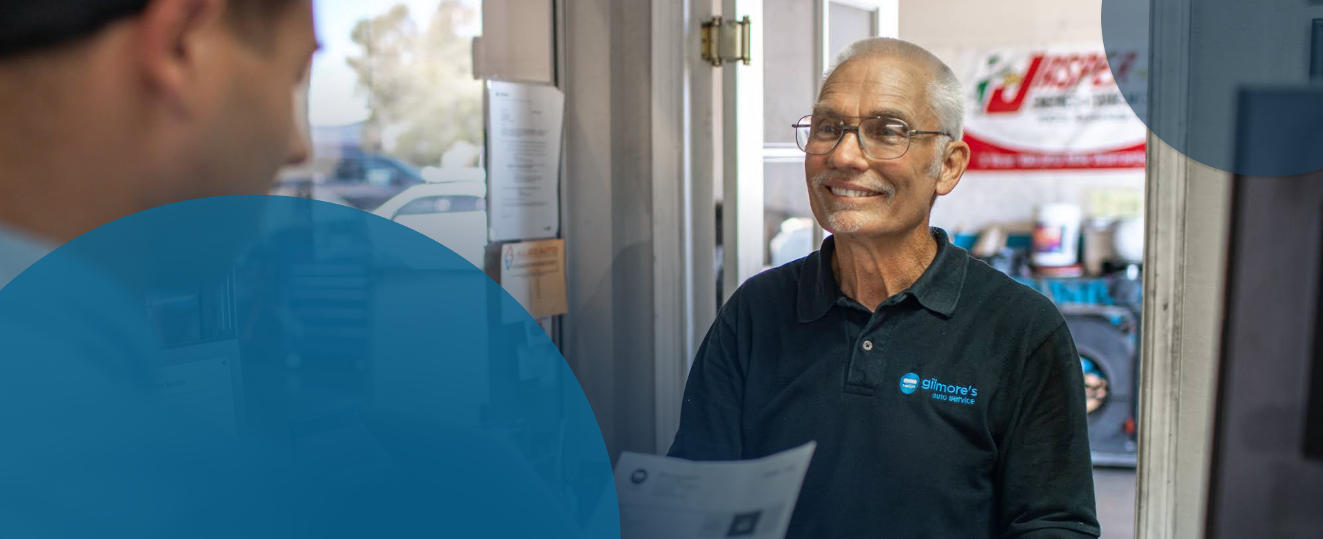 Two person talking. | Gilmore's Auto service