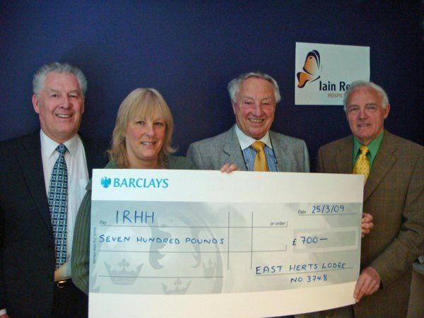 W Bros Ken Carbin and Alan Verney with Clive Verney and Liz Clarke from the Iain Rennie Hospice at Home