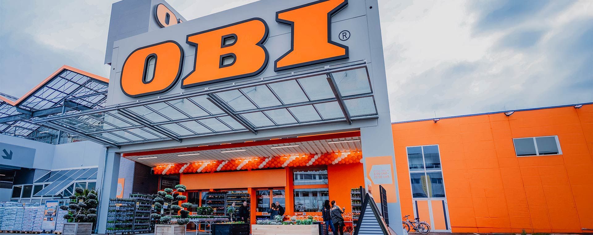 A large orange building with a sign that says OBI on it.