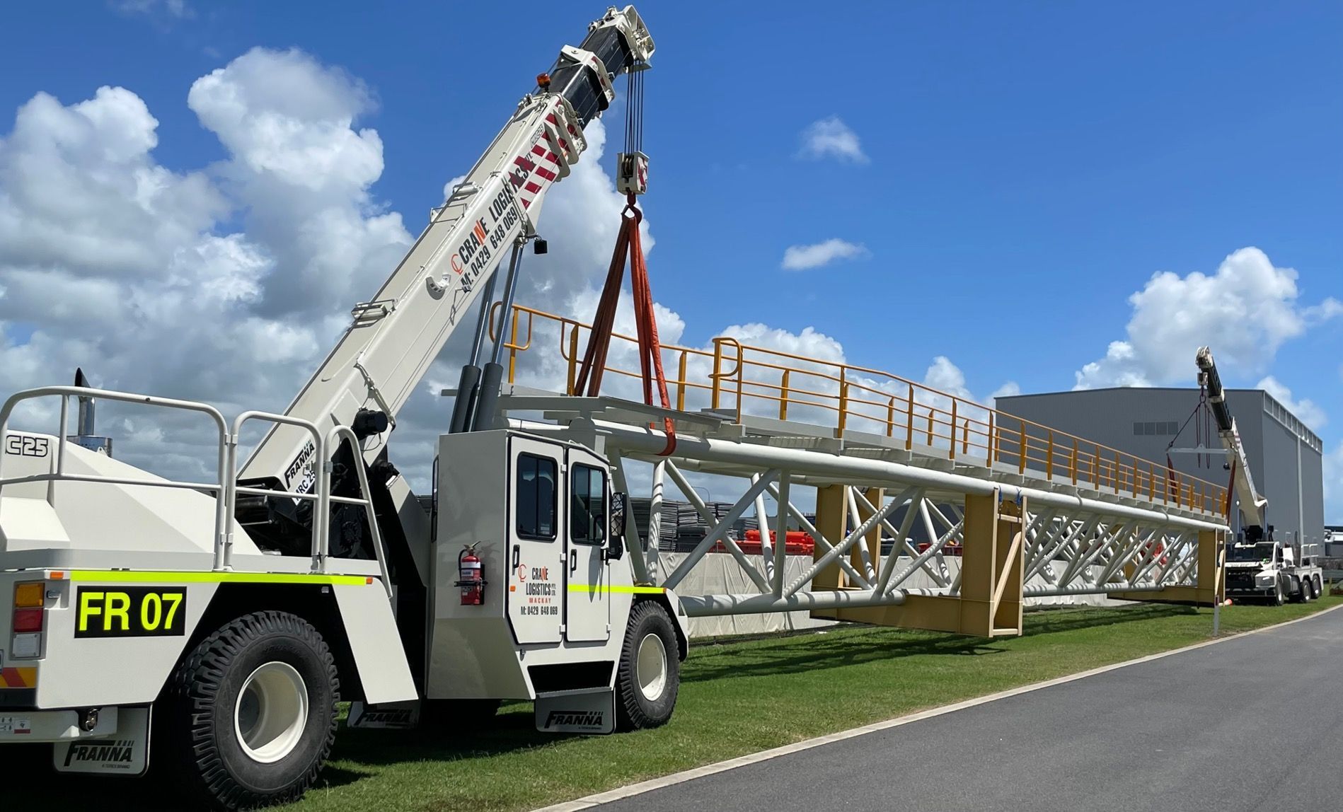 Franna Crane On A Construction Site — Cranes for Hire in Mackay, QLD
