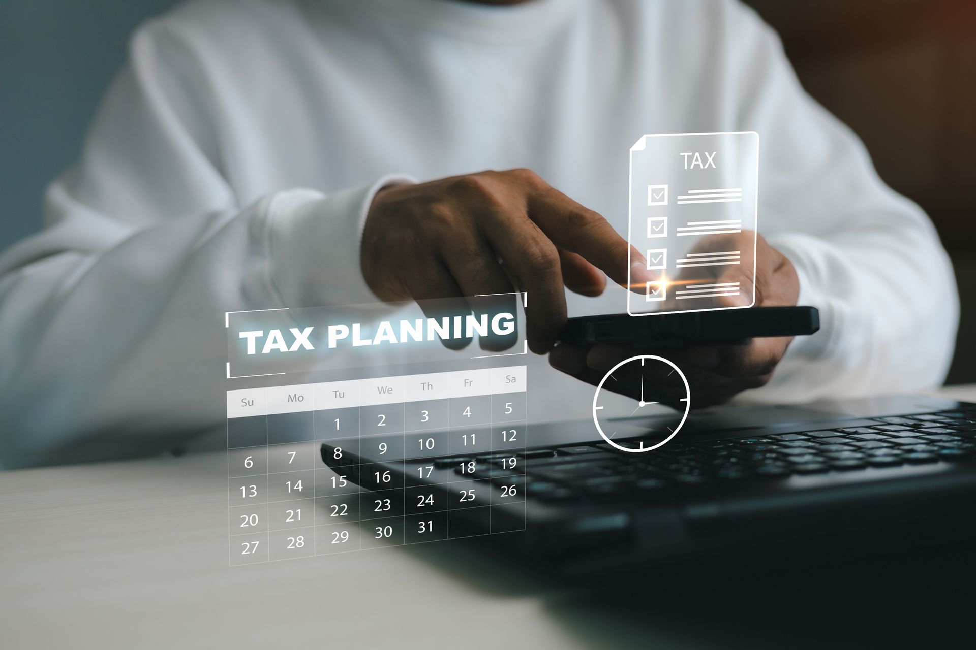 Hands typing on a laptop with a tax planning digital overlay and calculator icon