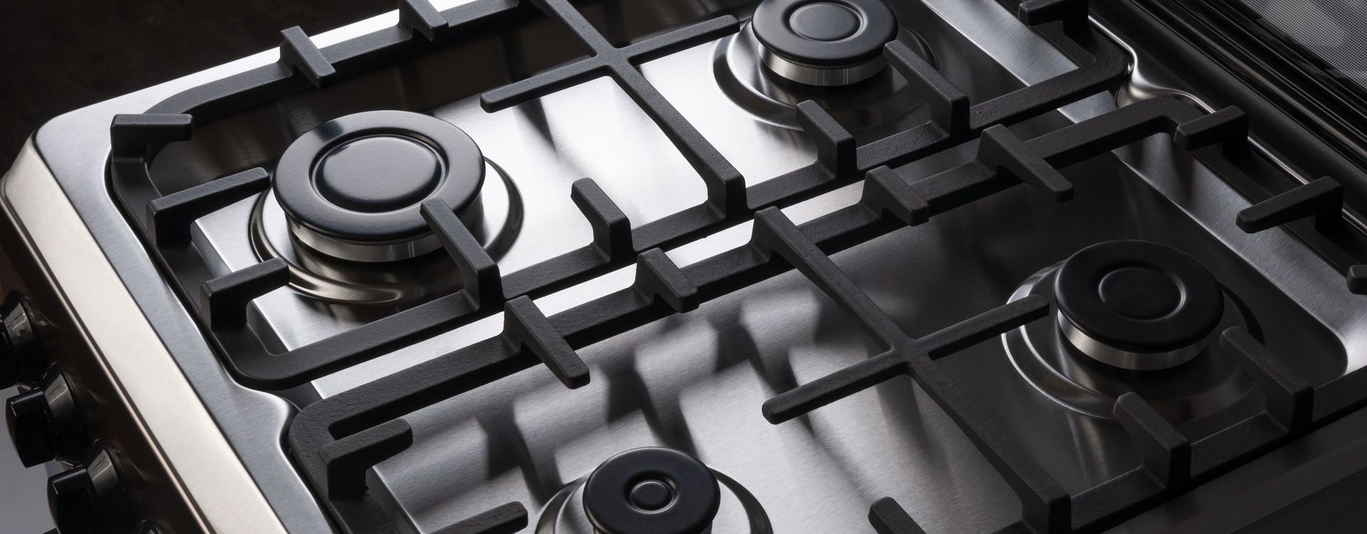 Hands connecting wires inside a machine. Black casing, various components visible.