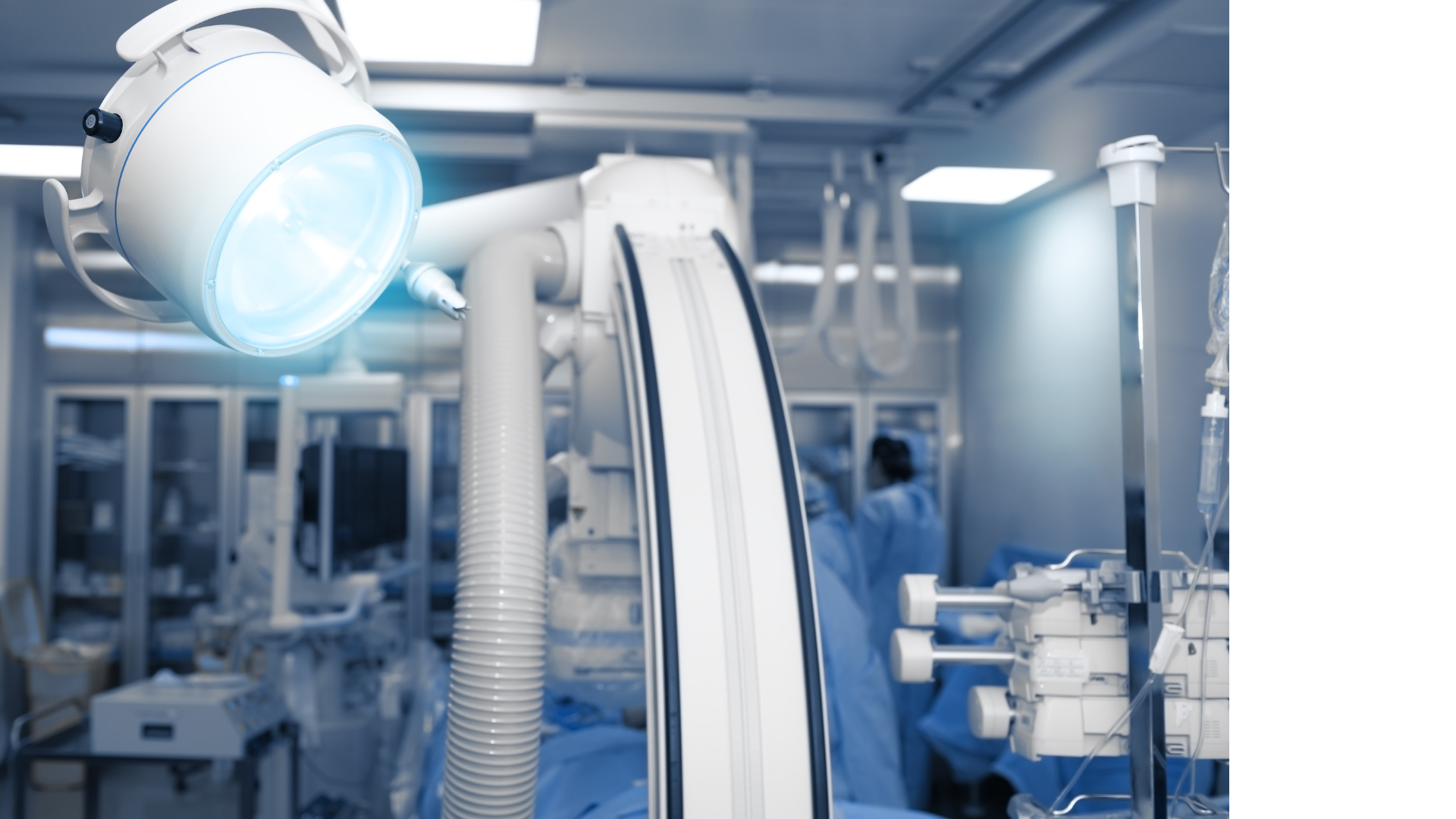 An operating room with a surgical light hanging from the ceiling.