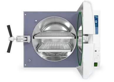 The inside of a dental autoclave with the door open.