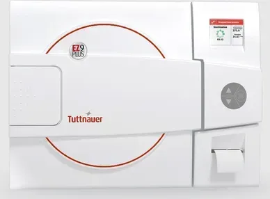 A white device that says tuttnauer on it