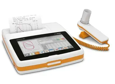 A white and orange device with a paper coming out of it.