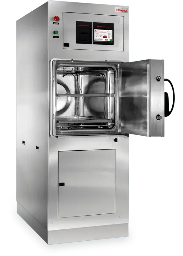 A large stainless steel machine with the door open