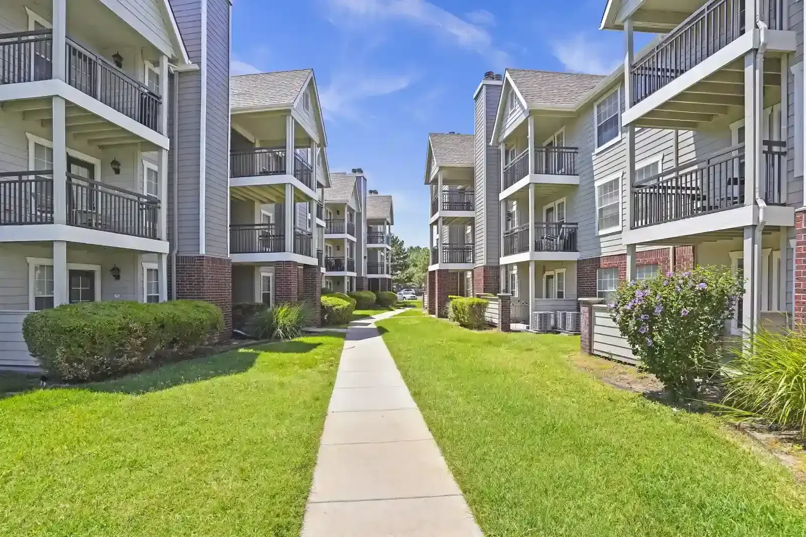 Pathway through landscaped apartment complex