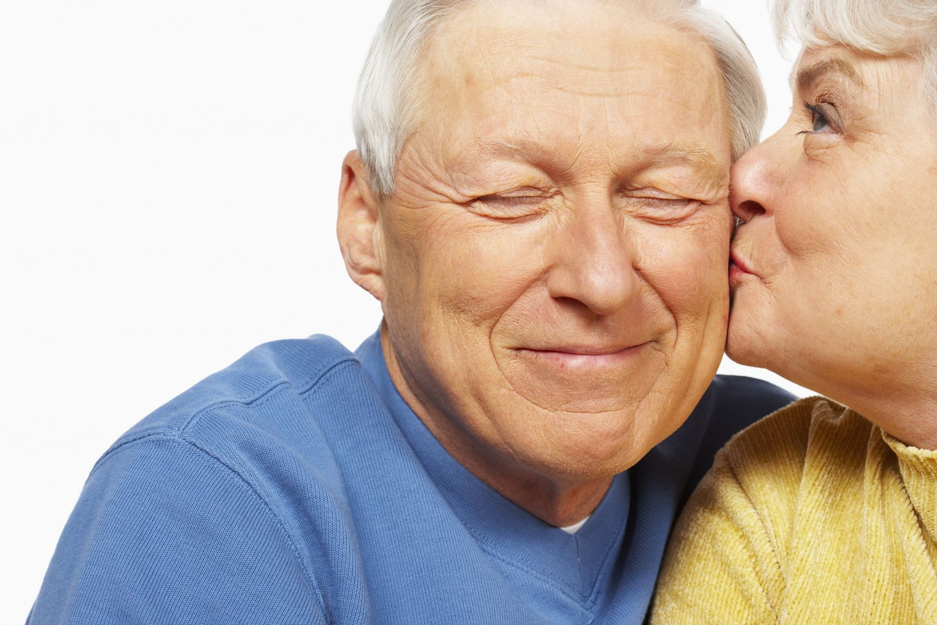 Elderly couple kiss in love