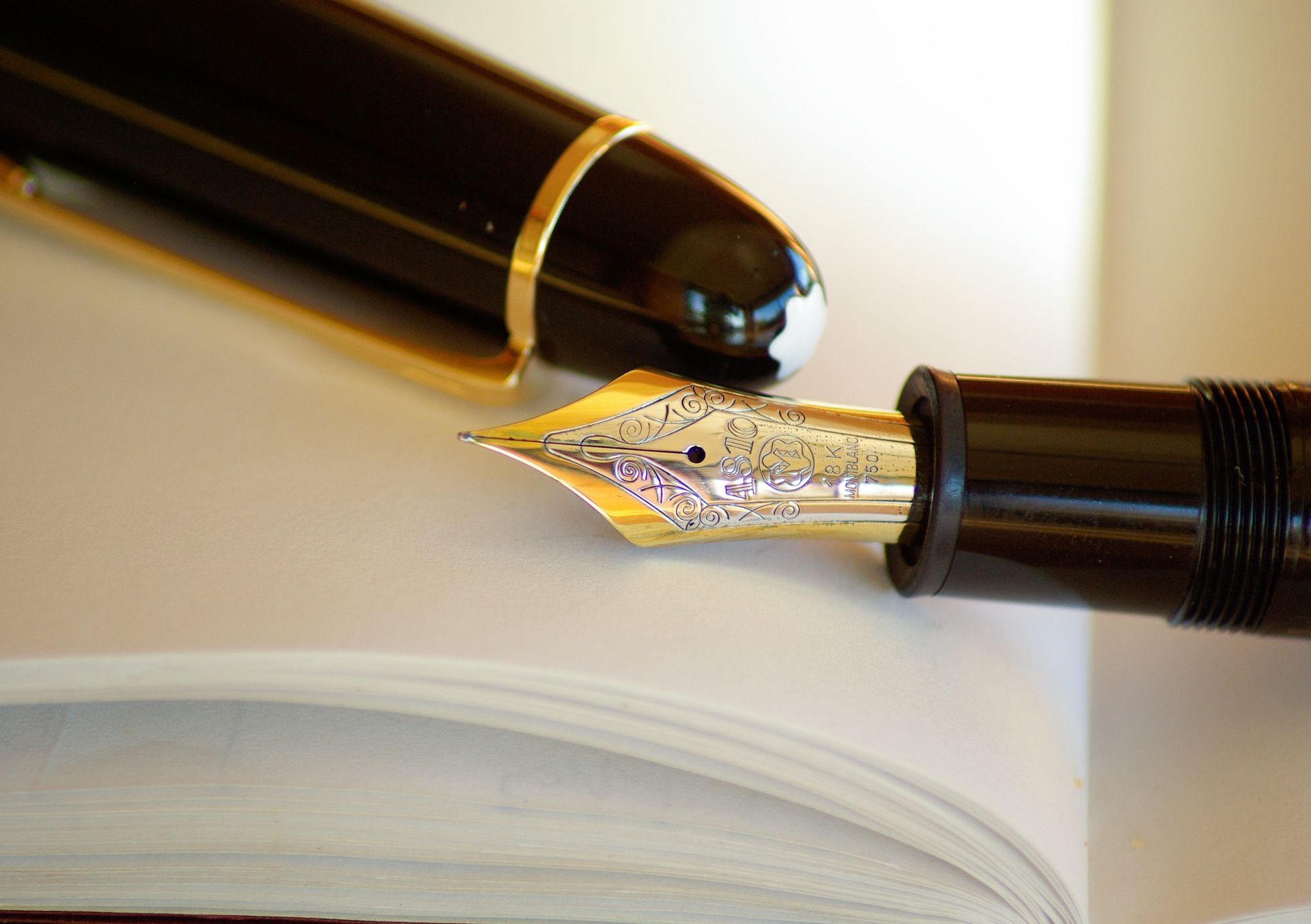 Fountain pen lay on top of will documents