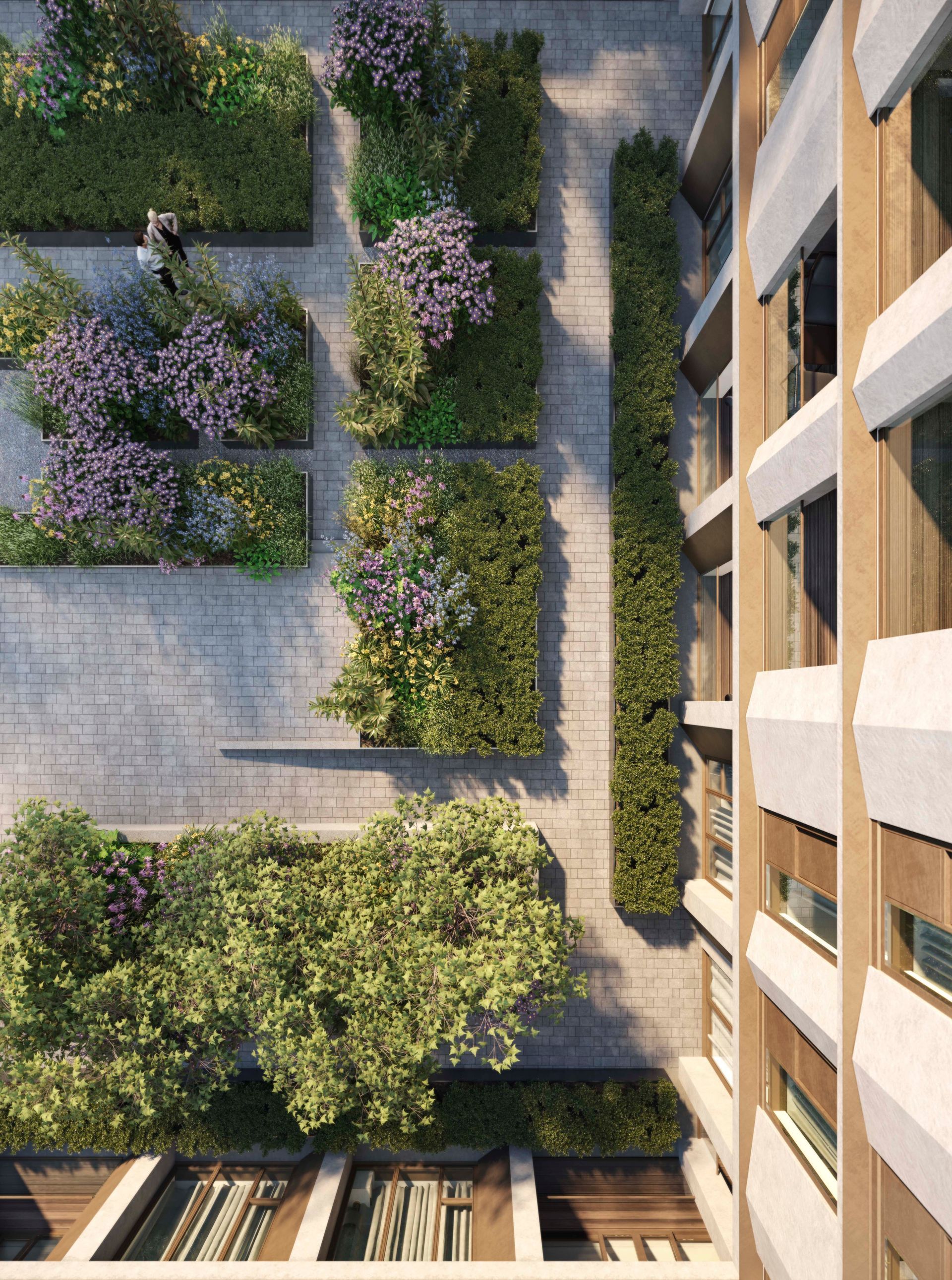 An aerial view of a building with a garden in the middle of it at Walton Court.