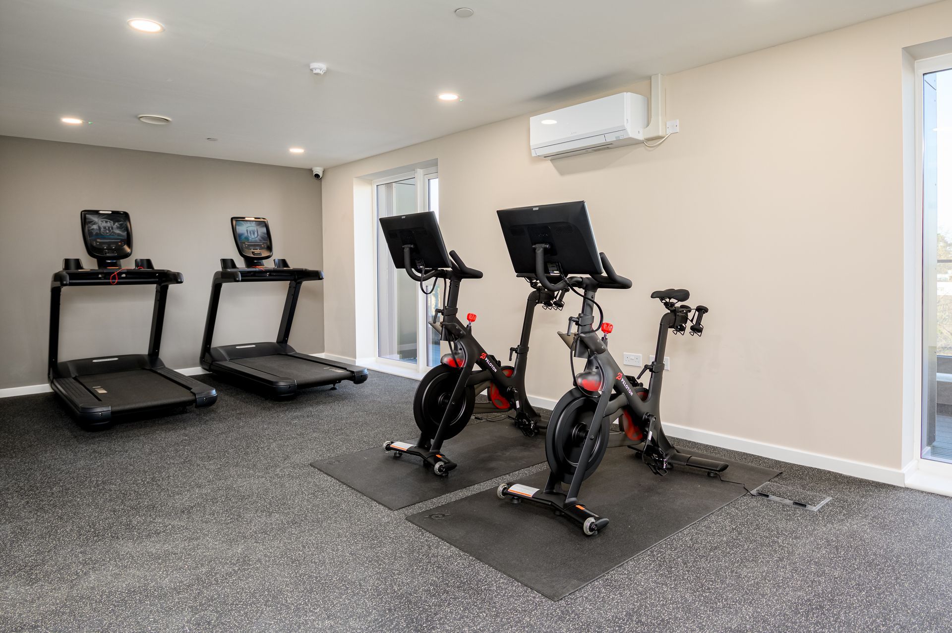 A gym with treadmills and exercise bikes at Walton Court.