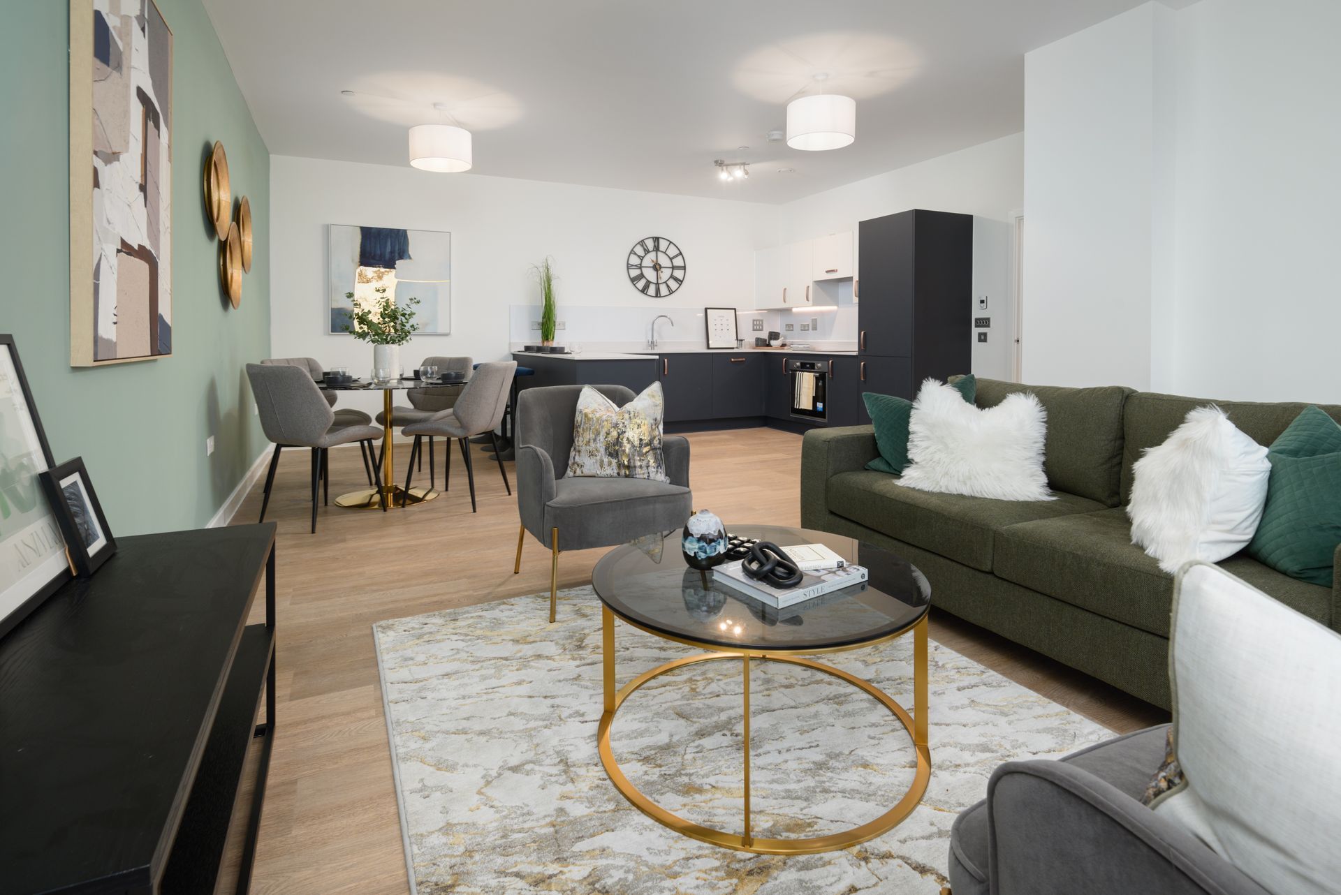 A living room with a couch , chairs , and a coffee table at Walton Court.