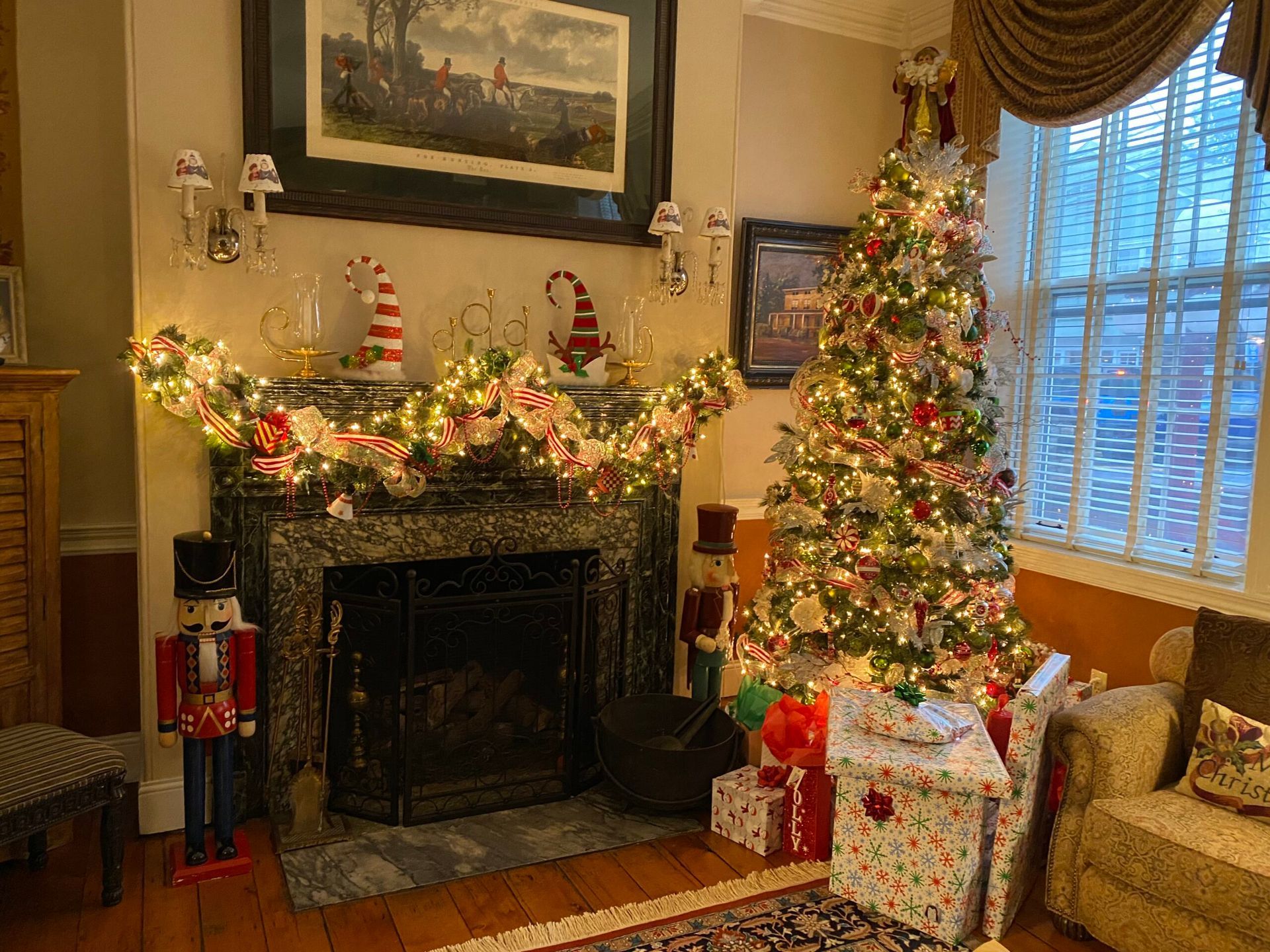Illuminated angel decorations in front of the brick exterior of The Bridge Street Inn at dusk.