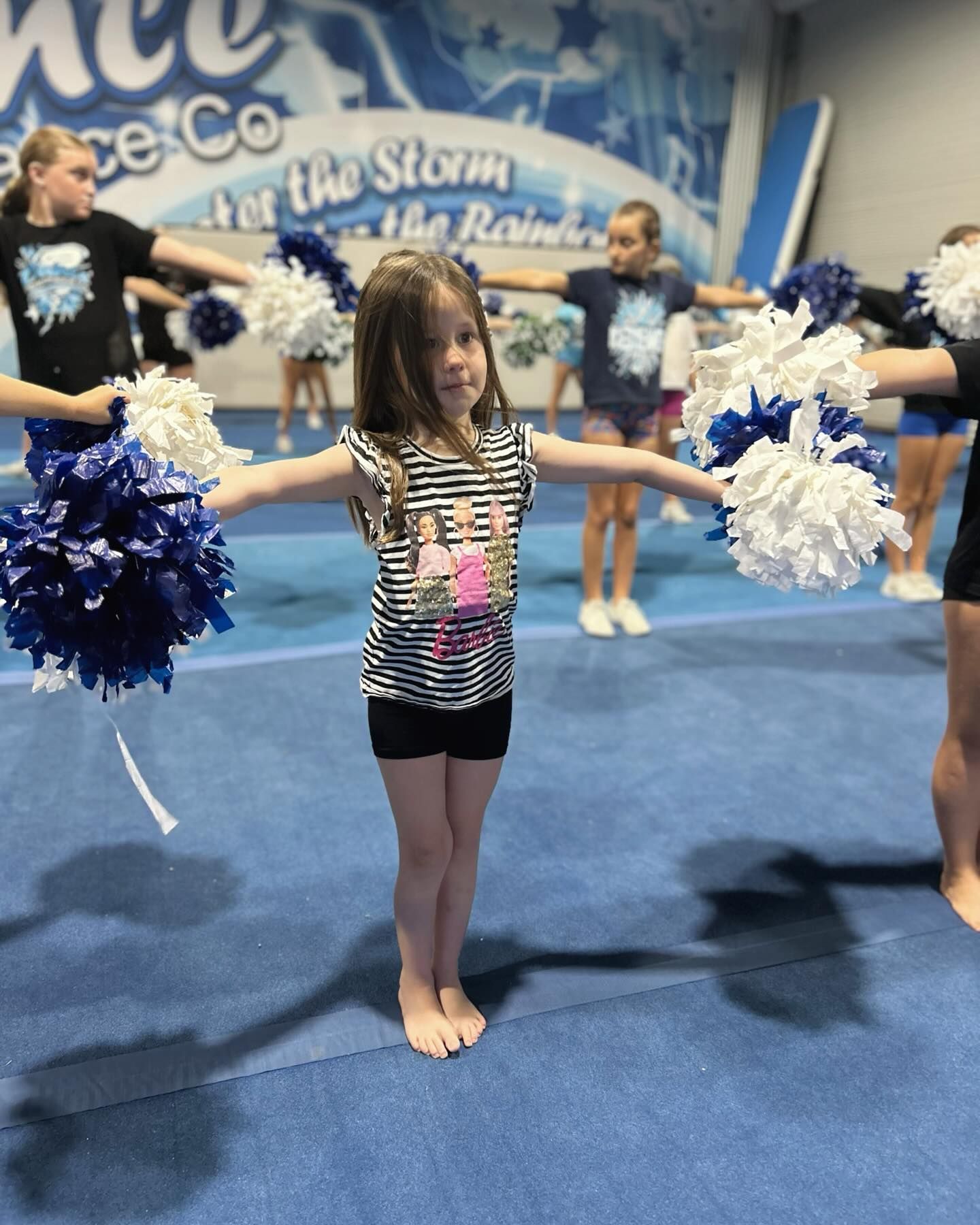 Girl With Outstretched Arms Holding Pom-poms, Standing With Cheerleaders — iDance Performance Co In Medowie, NSW