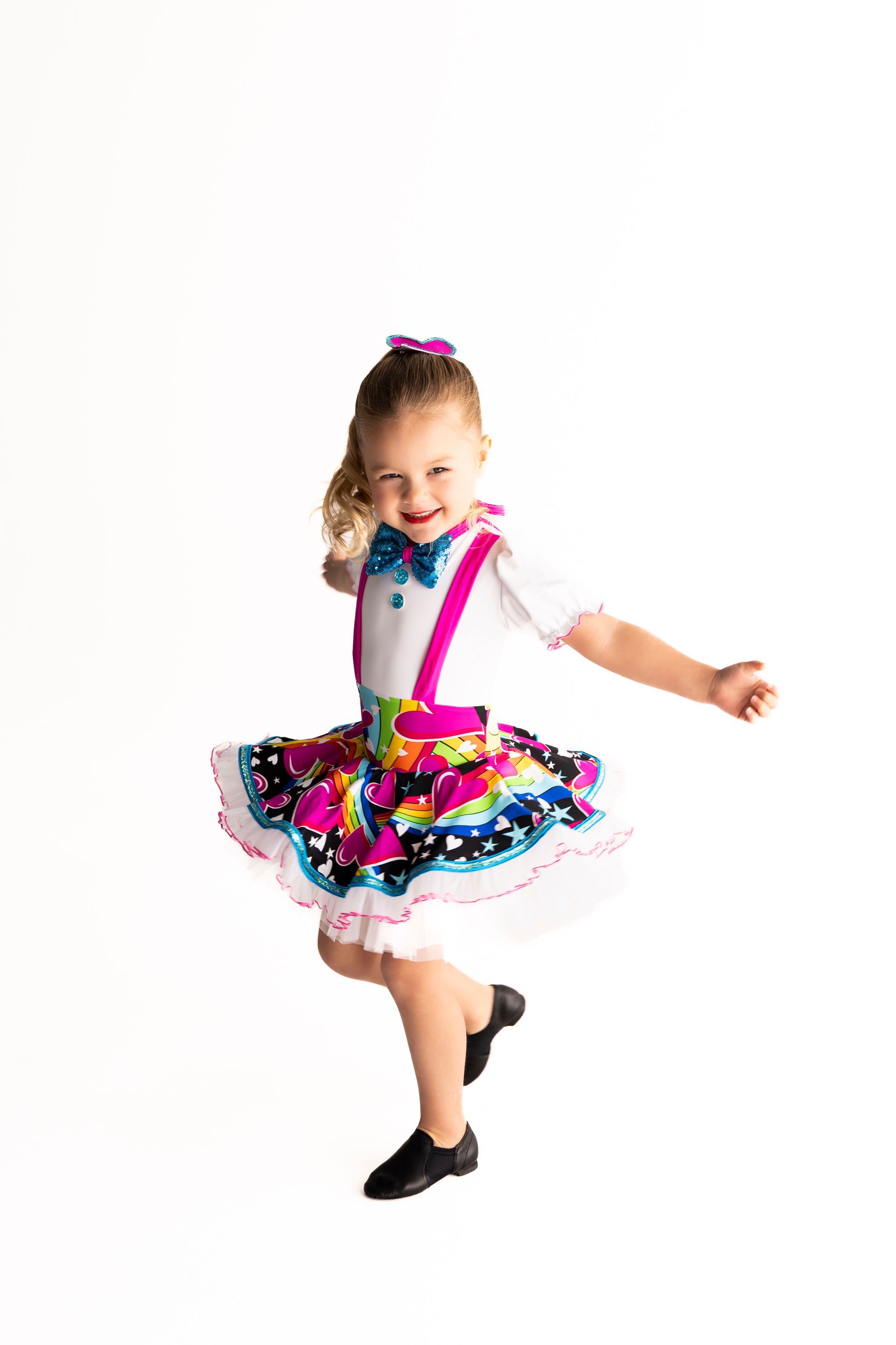 Young Girl in a Colourful Dance Costume, Smiling While Dancing — iDance Performance Co In Medowie, NSW