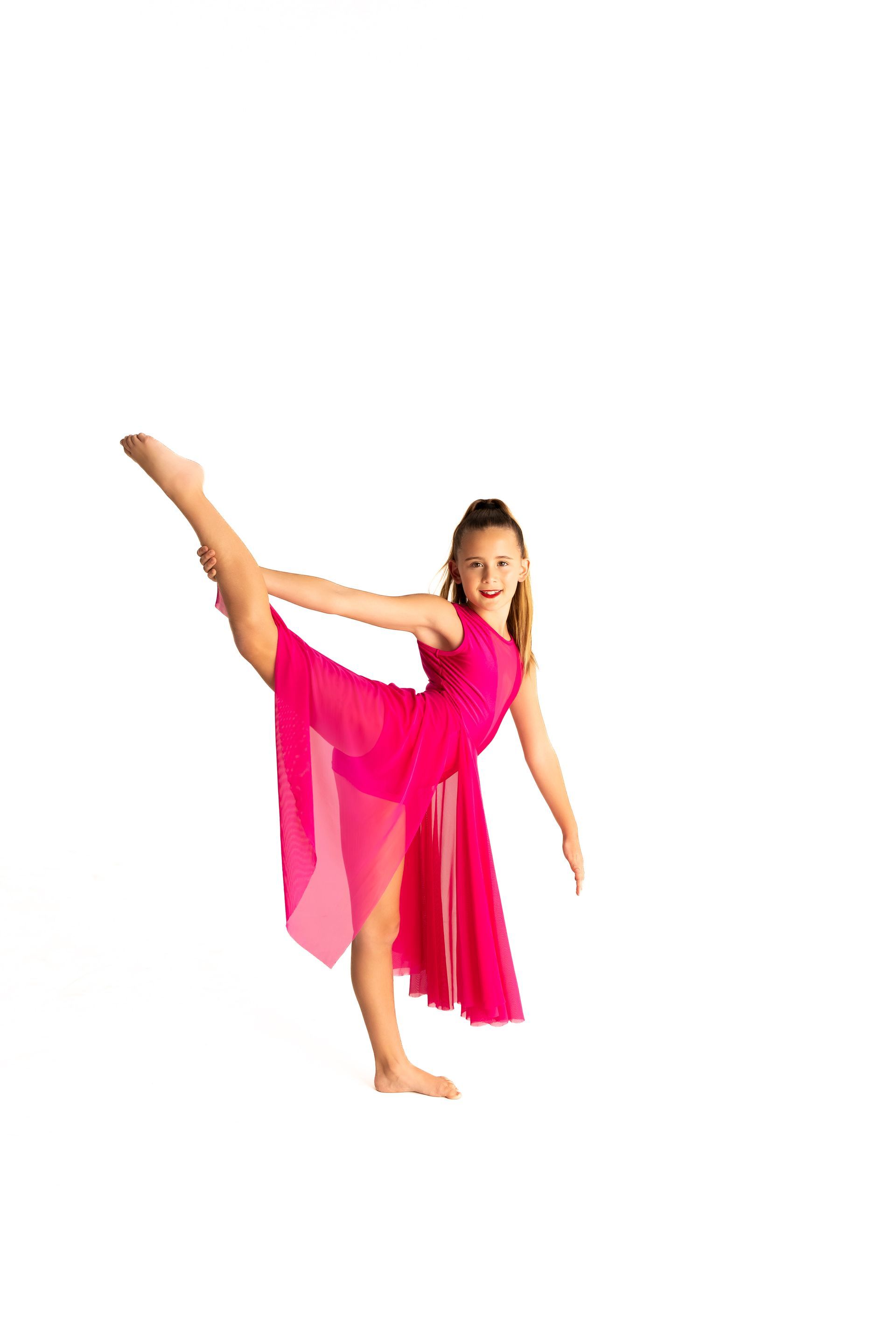 Young Dancer in a Pink Dress, Balances With One Leg Extended Up, Arms Out — iDance Performance Co In Medowie, NSW