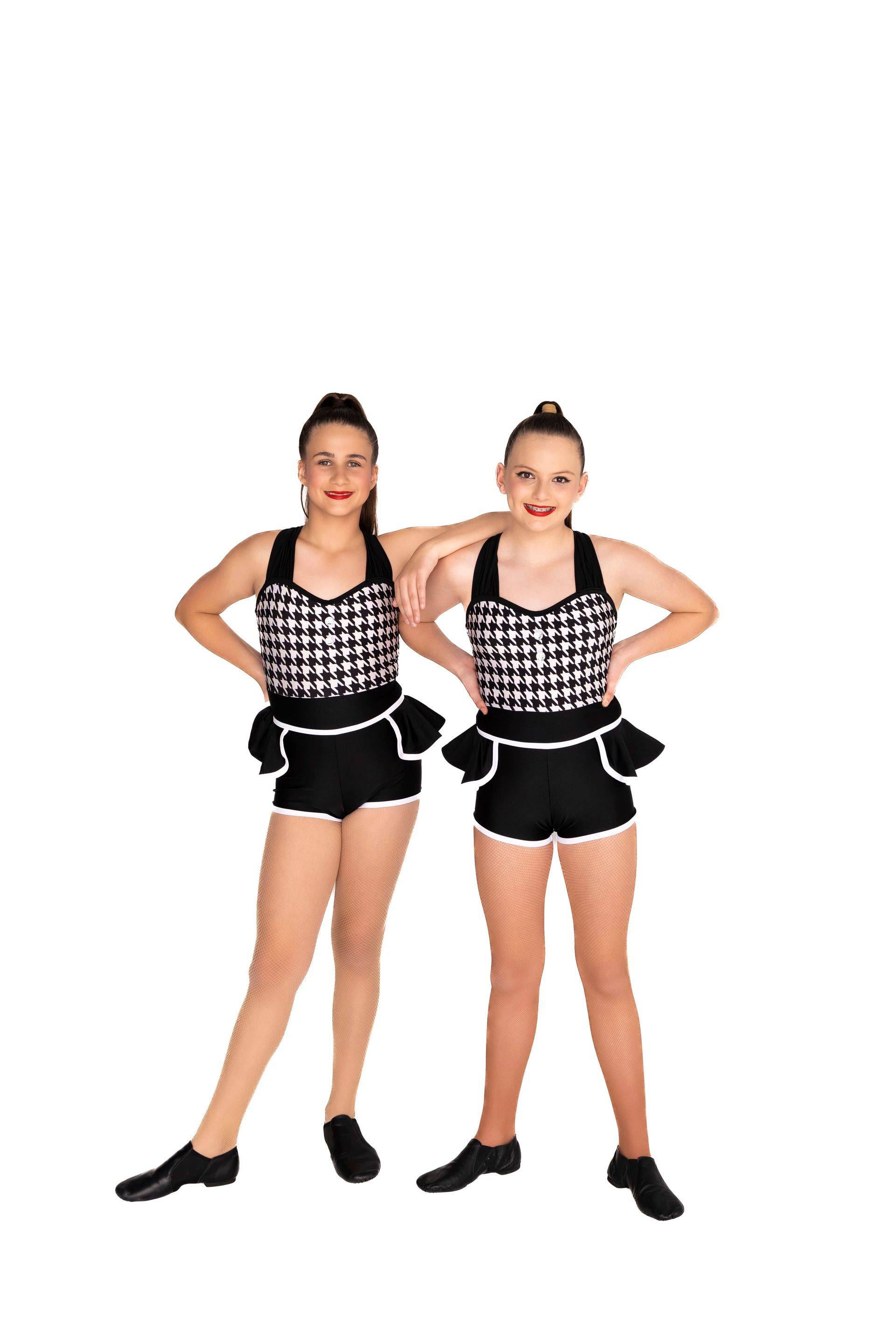 Two dancers in matching black and white outfits pose against a white backdrop — iDance Performance Co In Medowie, NSW